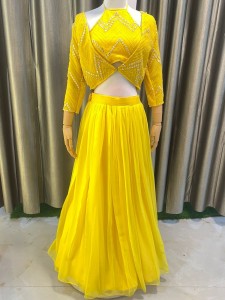 Bright yellow three piece lehenga set